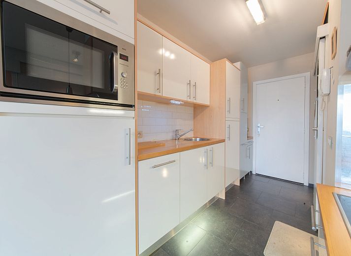 Cozy interior space of Apartment Firenze 011 in Bredene, Belgian coast, with comfortable sitting area and modern kitchen.