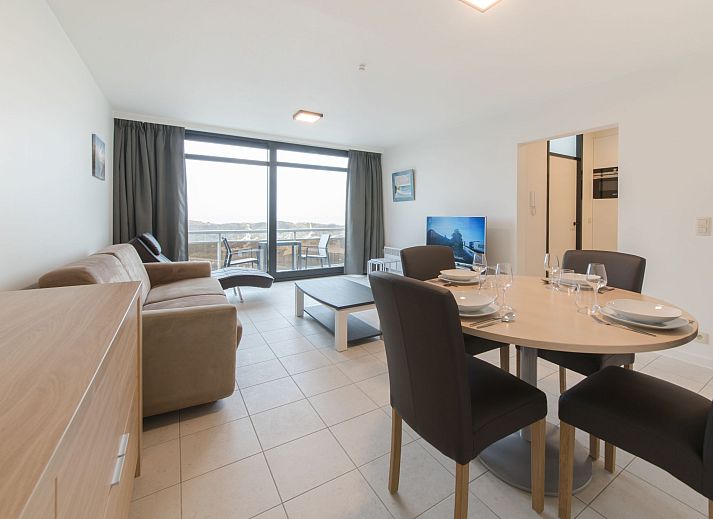 Spacious living room of Apartment Seaview 4 in Bredene, Belgian coast, with modern furnishings and terrace views.