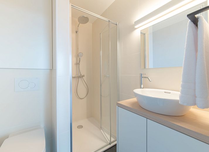 Spacious living room of Apartment Seaview 4 in Bredene, Belgian coast, with modern furnishings and terrace views.