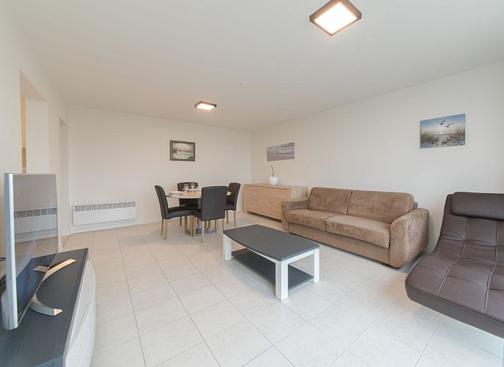 Spacious living room of Apartment Seaview 4 in Bredene, Belgian coast, with modern furnishings and terrace views.