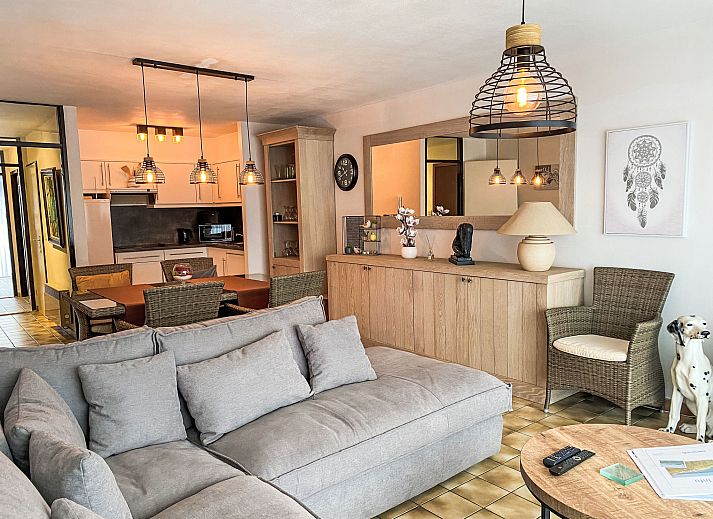 Spacious living room of Apartment 103 in Bredene on the Belgian coast, with comfortable seating and dining area for a relaxing stay.