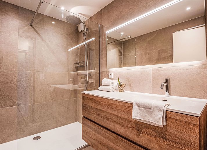 Spacious living room of Apartment 103 in Bredene on the Belgian coast, with comfortable seating and dining area for a relaxing stay.