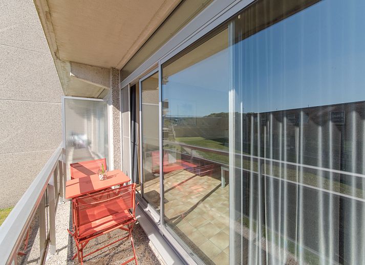 Spacious living room of Apartment 103 in Bredene on the Belgian coast, with comfortable seating and dining area for a relaxing stay.