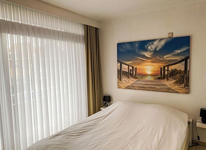 Spacious living room of Apartment 103 in Bredene on the Belgian coast, with comfortable seating and dining area for a relaxing stay.