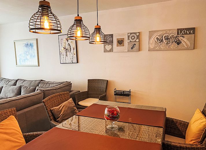 Cozy living room of Apartment 103 in Bredene, Belgian coast, with comfortable sitting area and modern kitchen.