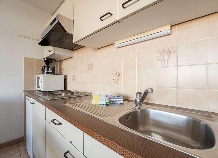 Cozy interior space of Apartment Studio 62-705 in Bredene, Belgian coast, with kitchen and comfortable sitting area.