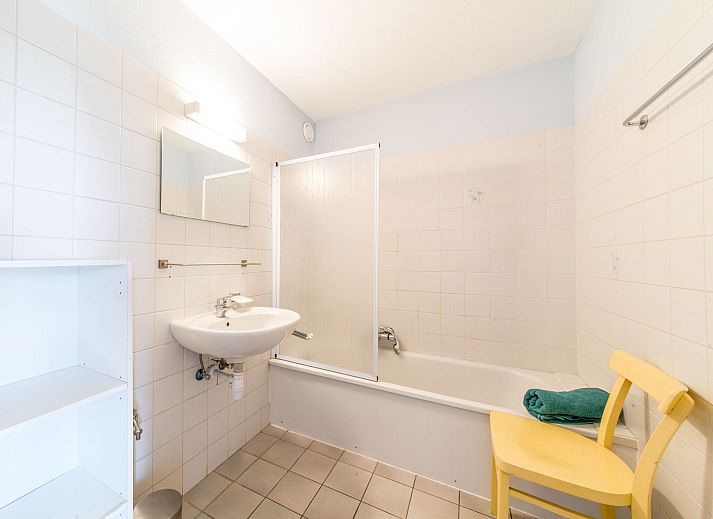 View from the balcony of Apartment Residence Astrid in Bredene on the Belgian coast, with green parks and the sea in the distance.