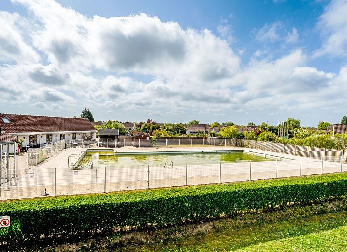 Cozy bedroom in Apartment Zeewind II A 11, Bredene on the Belgian coast, with rustic wooden interior and natural light.