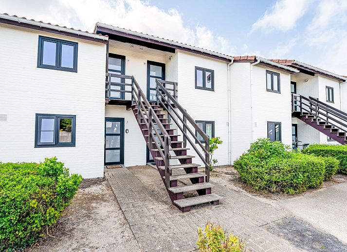 Cozy bedroom in Apartment Zeewind II A 11, Bredene on the Belgian coast, with rustic wooden interior and natural light.