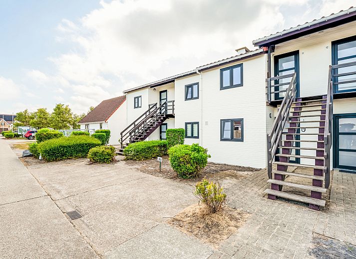 Cozy bedroom in Apartment Zeewind II A 11, Bredene on the Belgian coast, with rustic wooden interior and natural light.