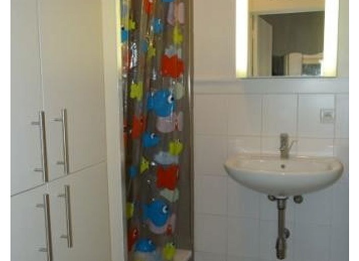 Dining area in child-friendly vacation apartment, Bredene, Belgian coast, with modern furniture and bright decor.