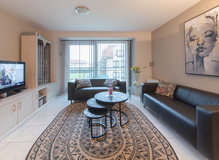 Cozy living room of Apartment The Holiday Dunes by the Sea in Bredene, Belgian coast, with modern interior and light.
