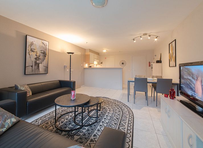 Cozy living room of Apartment The Holiday Dunes by the Sea in Bredene, Belgian coast, with modern interior and light.