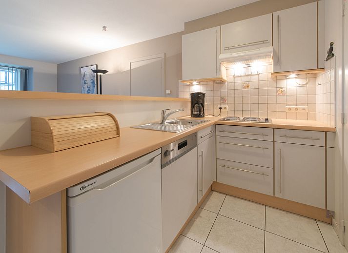 Cozy living room of Apartment The Holiday Dunes by the Sea in Bredene, Belgian coast, with modern interior and light.