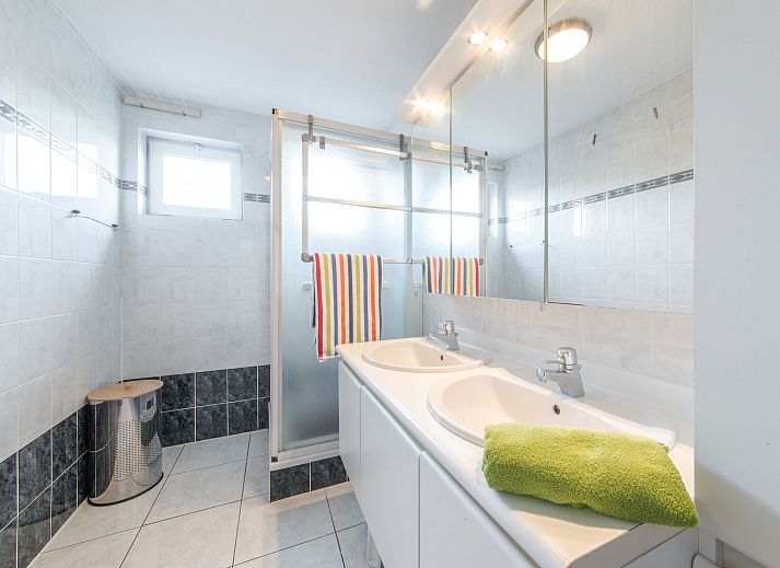 Stylish living room of Apartment The Holiday Dunes by the Sea in Bredene, Belgian coast, with modern interior and views of the surroundings.
