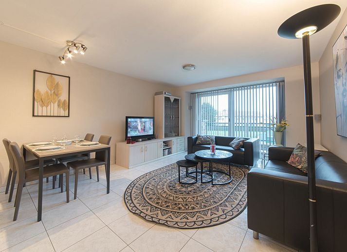 Stylish living room of Apartment The Holiday Dunes by the Sea in Bredene, Belgian coast, with modern interior and views of the surroundings.