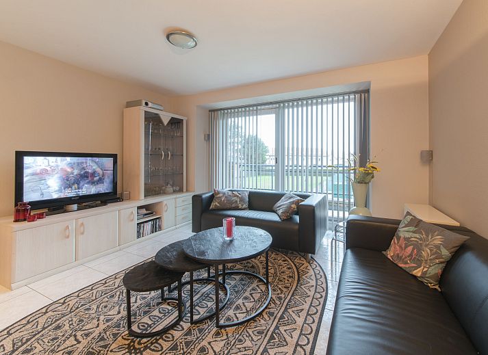 Stylish living room of Apartment The Holiday Dunes by the Sea in Bredene, Belgian coast, with modern interior and views of the surroundings.