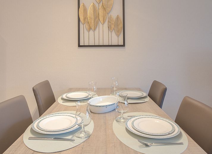 Cozy living room in Apartment De vakantieduinen aan zee, Bredene, Belgian coast, with modern furnishings and comfortable seating area.