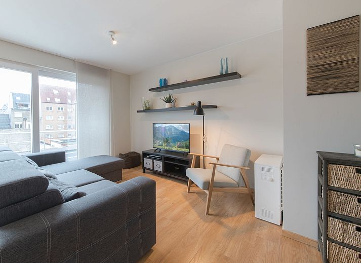 Cozy interior space of Apartment Duplex in Bredene on the Belgian coast, with modern dining room and comfortable sitting area.