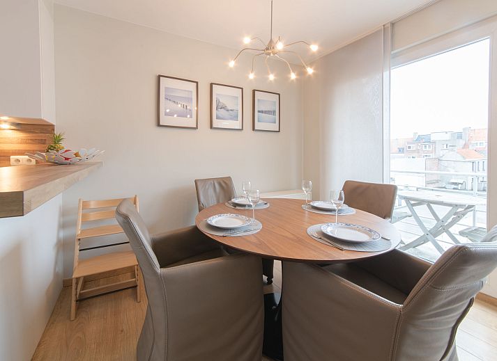 Cozy interior space of Apartment Duplex in Bredene on the Belgian coast, with modern dining room and comfortable sitting area.