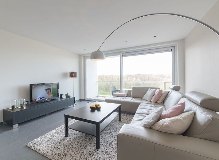 Modern living room in Apartment Solis, Bredene, Belgian coast, with stylish decor and comfortable seating area.