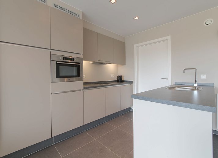 Modern living room in Apartment Solis, Bredene, Belgian coast, with stylish decor and comfortable seating area.