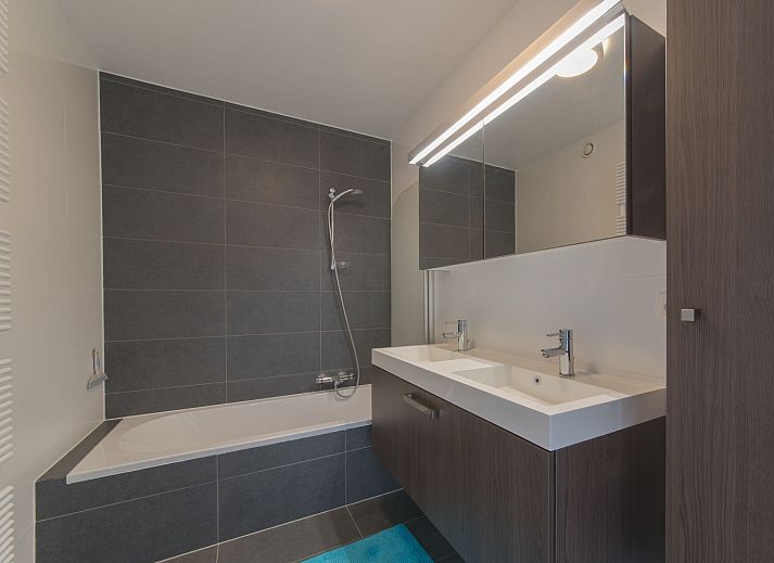 Cozy living room of Apartment Solis in Bredene, Belgian coast, with modern decor and views of nature.