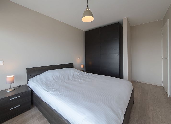 Cozy living room of Apartment Solis in Bredene, Belgian coast, with modern decor and views of nature.
