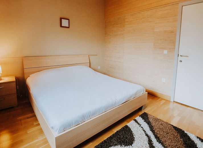 Cozy living room in Apartment De Paddock, Bredene, Belgian coast. Comfortable sitting area with warm decor for a relaxing stay.