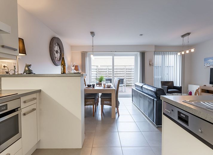 Cozy living room of Apartment Residentie Zandloper in Bredene, Belgian coast, with modern decor and lots of natural light.