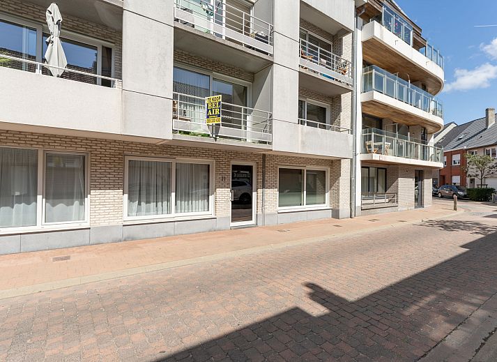 Enjoy the spacious terrace at Apartment Residentie Zandloper in Bredene, Belgian coast, ideal for relaxed outdoor dining.