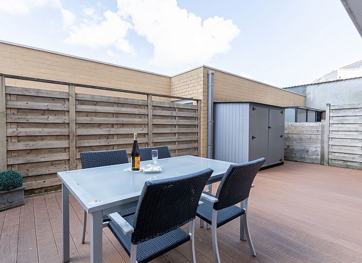 Enjoy the spacious terrace at Apartment Residentie Zandloper in Bredene, Belgian coast, ideal for relaxed outdoor dining.