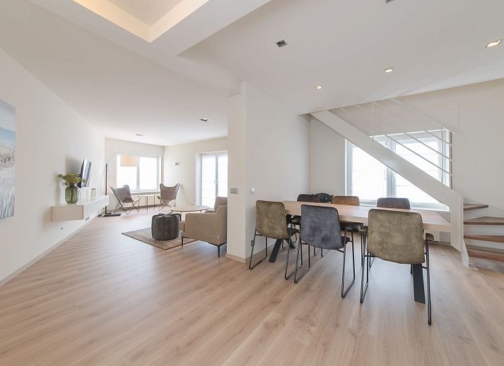 Stylish interior of Apartment Alaska Beach in Bredene, Belgian coast, with spacious living room and dining area for a relaxing stay.