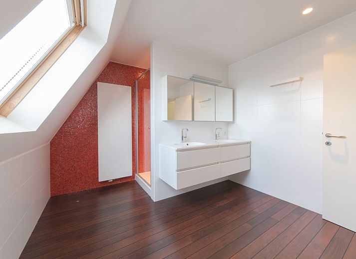Stylish living room in Apartment Alaska Beach, Bredene, Belgian coast. Comfortable sitting area with lots of natural light and modern decor.