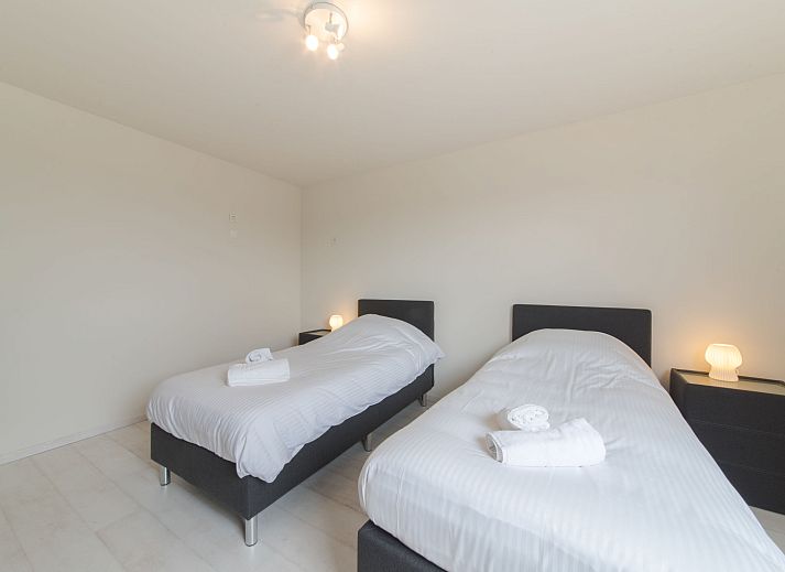 Enjoy the spacious terrace at Apartment Alaska Beach in Bredene, Belgian coast, ideal for relaxation overlooking nature.