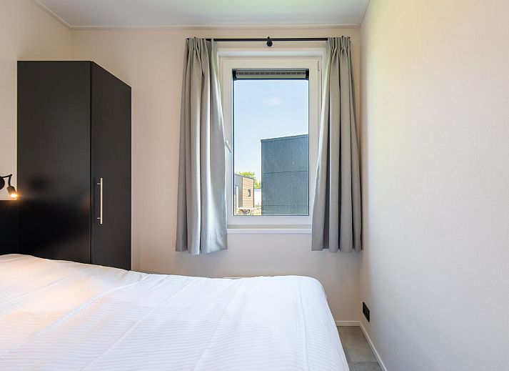 Geniet van een ontspannen verblijf in de Wood Lodge, Nieuwpoort. Comfortabele binnenruimte met airco waar honden welkom zijn.