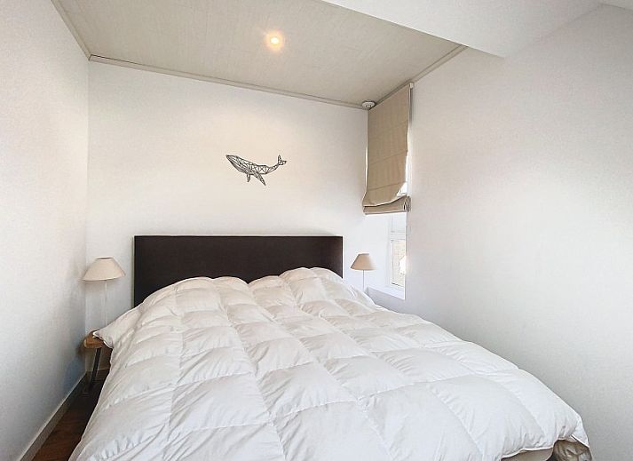 Dining room overlooking terrace in Tijl Uilenspiegel apartment, Belgian coast.