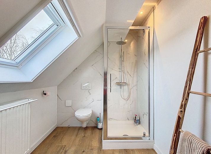 Dining room overlooking terrace in Tijl Uilenspiegel apartment, Belgian coast.