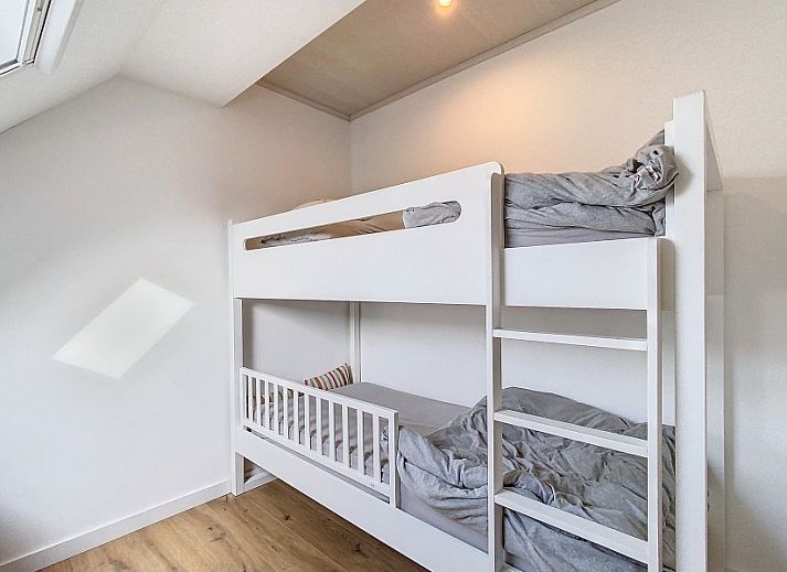 Dining room overlooking terrace in Tijl Uilenspiegel apartment, Belgian coast.