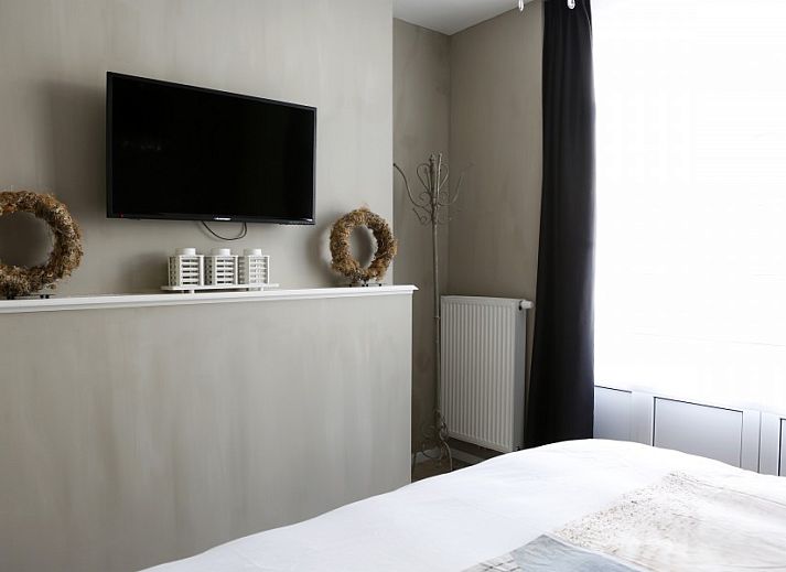 Moderne slaapkamer in appartement De Zeester in Oostende, Belgische kust met stijlvolle inrichting.