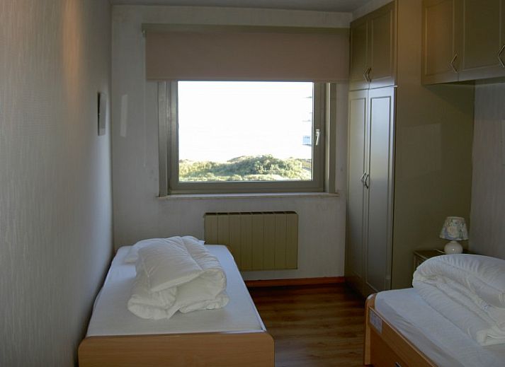 Cozy living room with sea view at 't Lange Lis apartment in De Panne, Belgian coast.