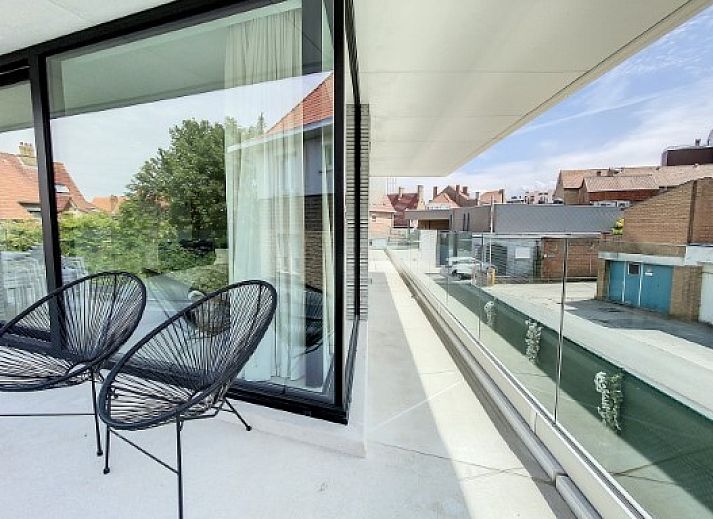 Sleek kitchen in Apartment "Asterias," De Panne, with lots of storage space and a kitchen island.