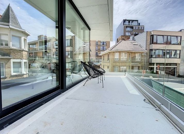 Sleek kitchen in Apartment "Asterias," De Panne, with lots of storage space and a kitchen island.
