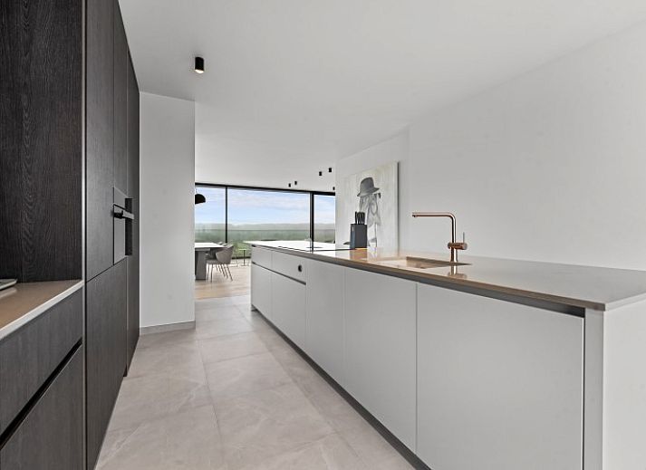 Luxury living room of Penthouse 'Ter Elst' in De Panne, Belgian coast, with panoramic views and modern furnishings for ultimate comfort.