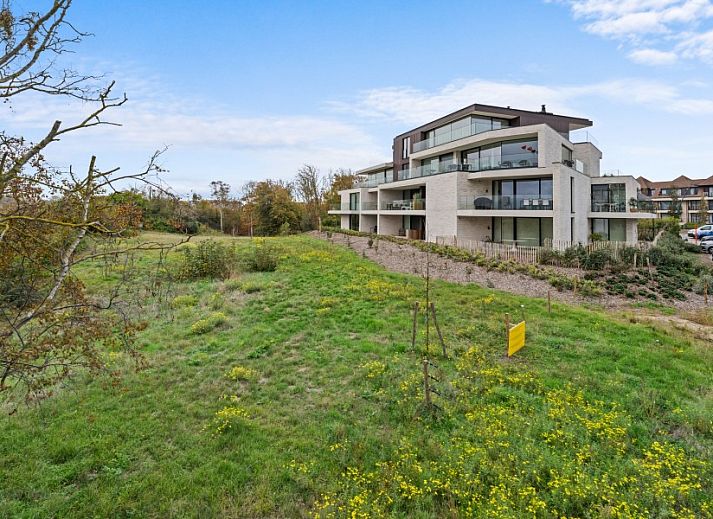 Modern dining room in Penthouse 'Ter Elst', De Panne, Belgian coast, with panoramic views of the surroundings and stylish interior.