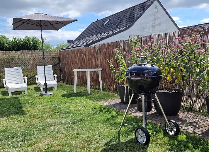Vissershuisje 89 in Wenduine, rustieke vakantieaccommodatie met ruime tuin aan de Belgische kust.