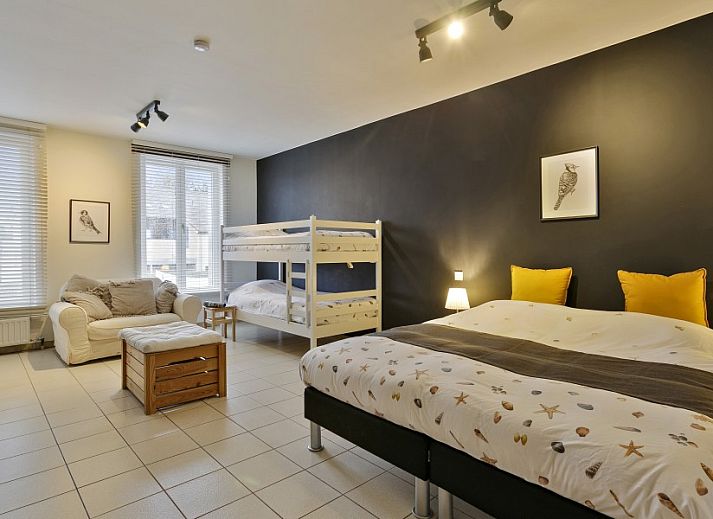 Street scene near Maison Lambic apartment in De Panne, Belgian coast, with charming local stores.