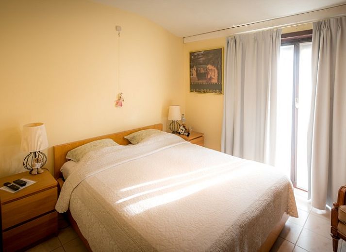 Exterior of B & B YACA in De Haan, Belgian coast, with sunny terrace and garden.