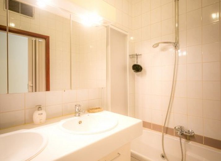 Exterior of B & B YACA in De Haan, Belgian coast, with sunny terrace and garden.