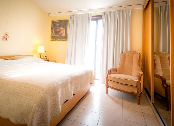 Exterior of B & B YACA in De Haan, Belgian coast, with sunny terrace and garden.